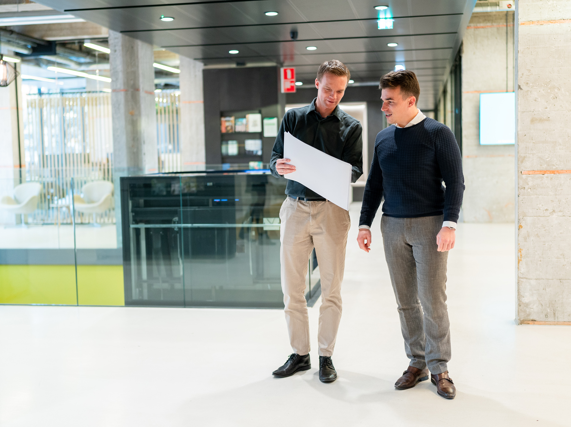 Two co-workers discussing work in our head office